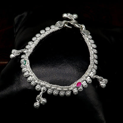 Sterling silver handmade baby anklet with jingling charms, customized design, ideal for kids jewelry and gift-giving.