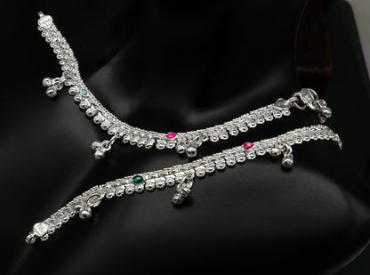 Sterling silver handmade customized baby anklet with jingling charms, designed for kids, featuring intricate tribal ornament details.