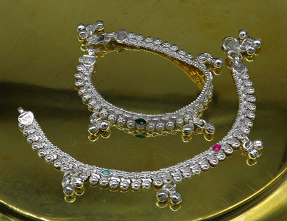 Sterling silver handmade baby anklet with customized design and jingling charms, suitable for kids and as a lovely gift.