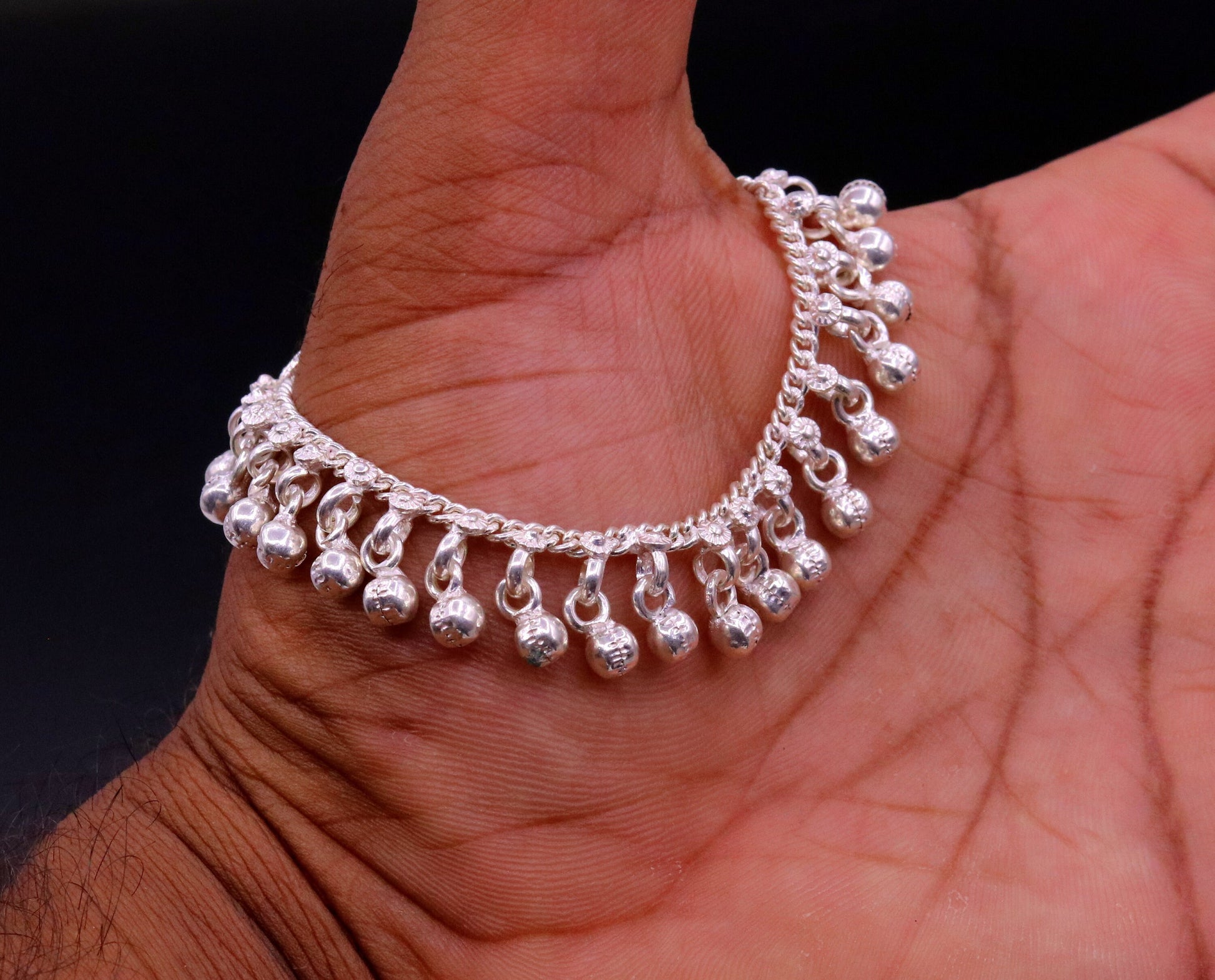 Sterling silver vintage baby anklet with hanging bells and drop charms, handmade tribal design for infants and toddlers.