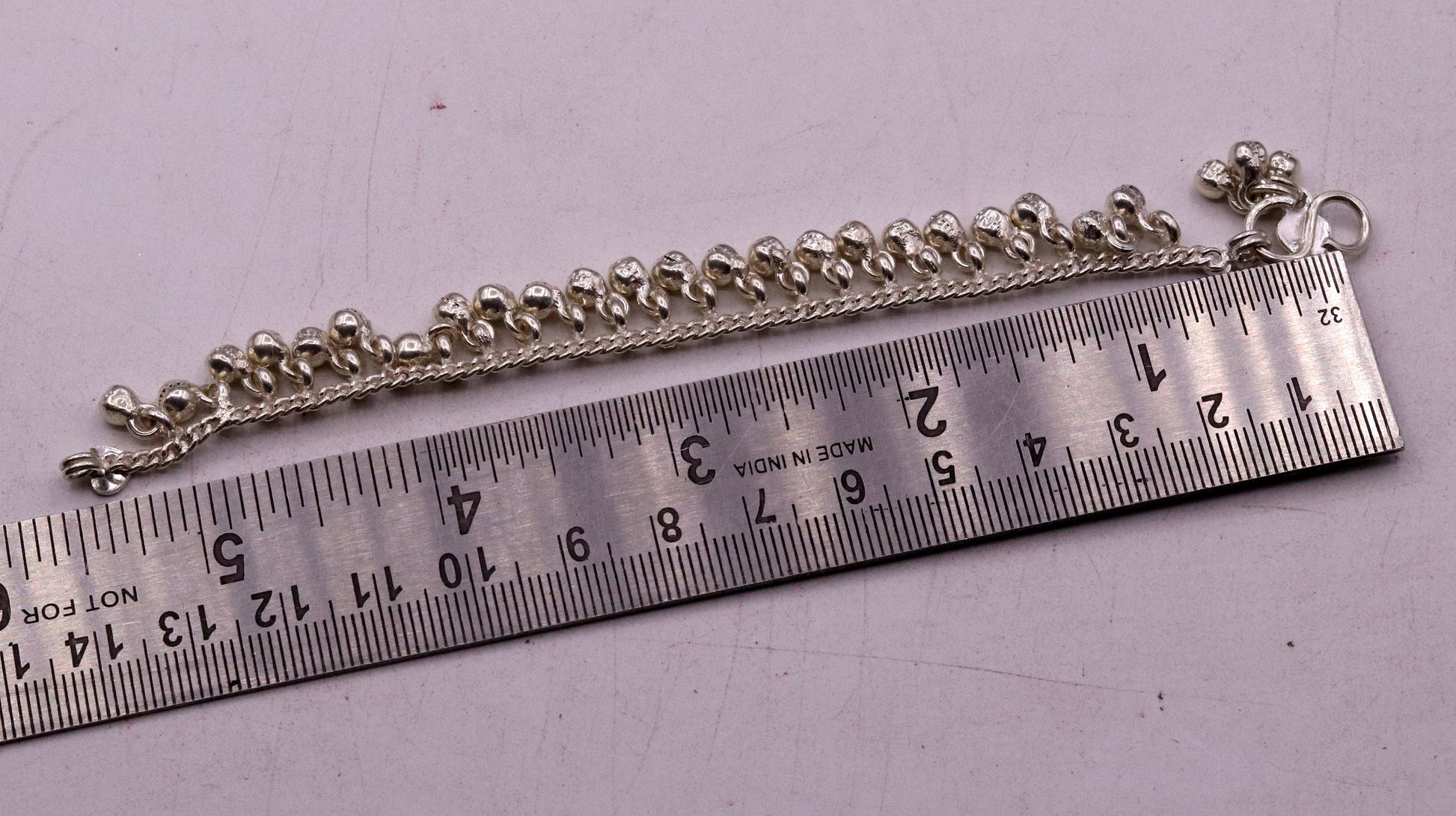 Sterling silver vintage baby anklet with hanging bell charms, handmade tribal design, 6-inch length, tribal ornaments brand.