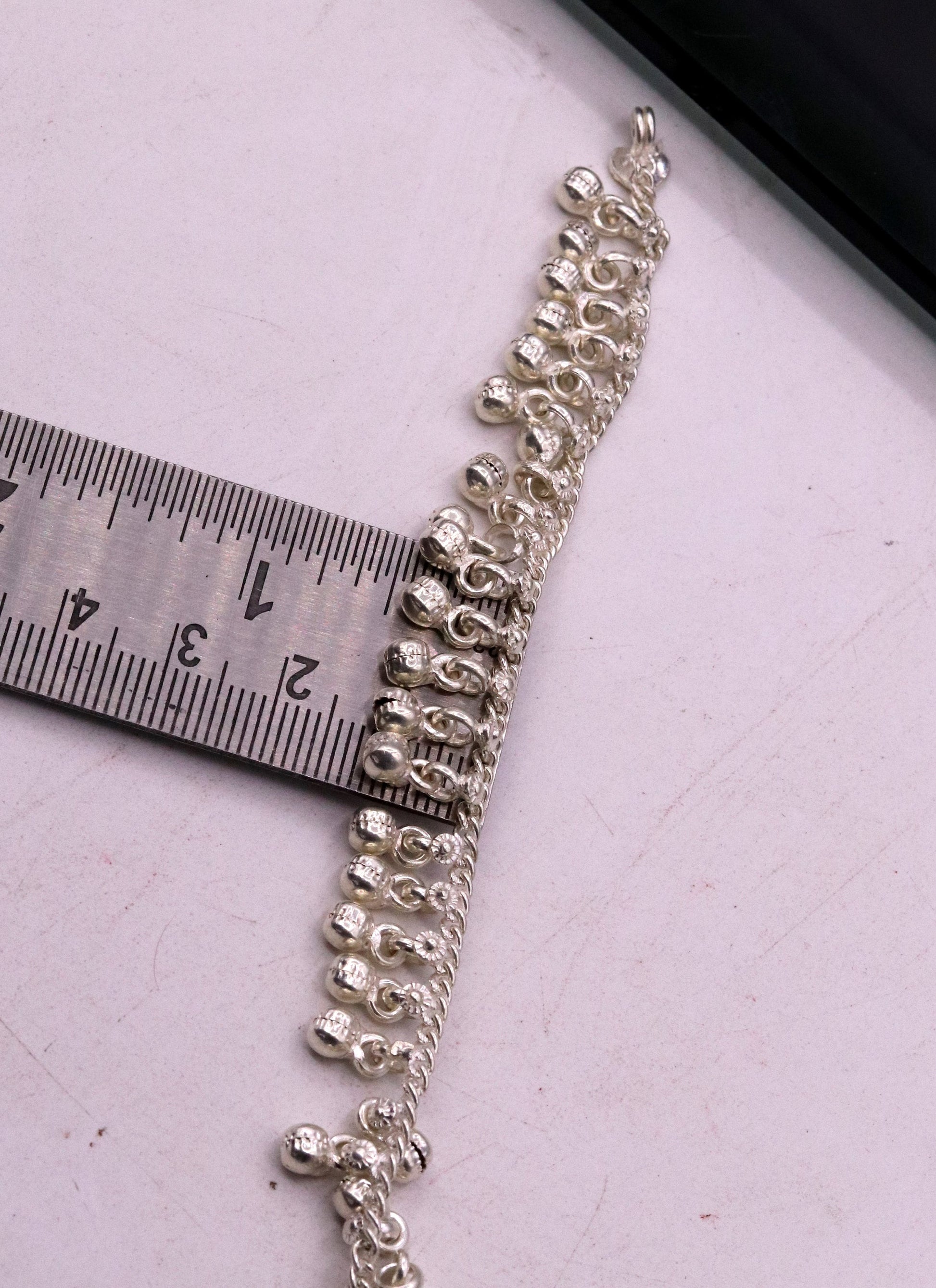 Sterling silver vintage baby anklet with hanging noisy bells and charms, handmade tribal design, 6-inch length.