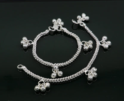 Sterling silver kids anklet with noisy bells and charms, custom designer baby ankle bracelet from Tribal Ornaments.