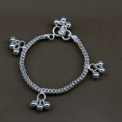 Sterling silver kids anklet with noisy bells and charms, customized designer jewelry for babies and children from Tribal Ornaments.