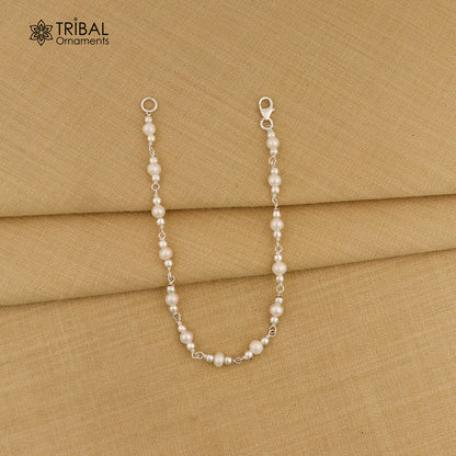 Handmade 7.5-inch sterling silver beaded bracelet with natural pearl, unisex design, crafted by TRIBAL ORNAMENTS for gifting.