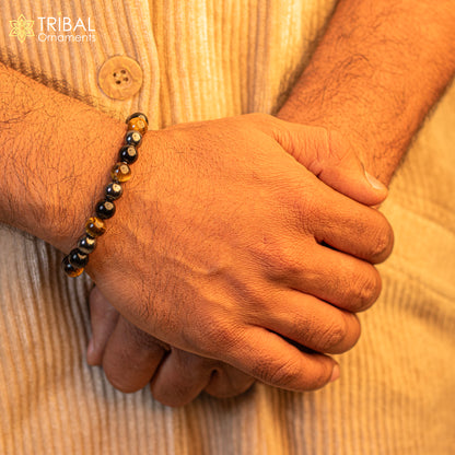 Handmade unisex 8mm tiger eye gemstone beaded bracelet with natural brown and gold tones, custom-designed jewelry by TRIBAL ORNAMENTS.