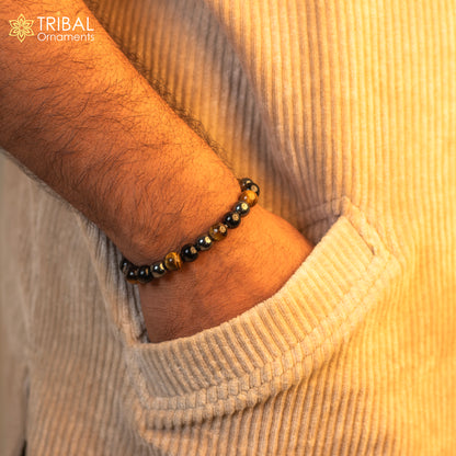 Handmade unisex bracelet with 8mm tiger eye gemstone beads, crafted by TRIBAL ORNAMENTS, featuring customized jewelry design.