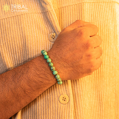 8 mm turquoise natural stone beaded handmade bracelet by TRIBAL ORNAMENTS, customizable unisex jewelry piece.