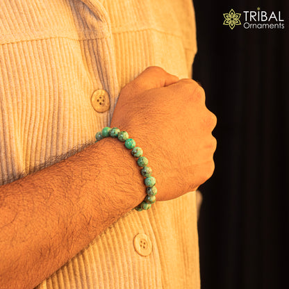 Handmade 8mm turquoise natural stone beaded bracelet by TRIBAL ORNAMENTS, unisex jewelry with customizable design.