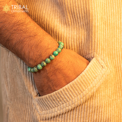 8 mm turquoise natural stone beaded handmade bracelet by TRIBAL ORNAMENTS, unisex jewelry with customizable design.