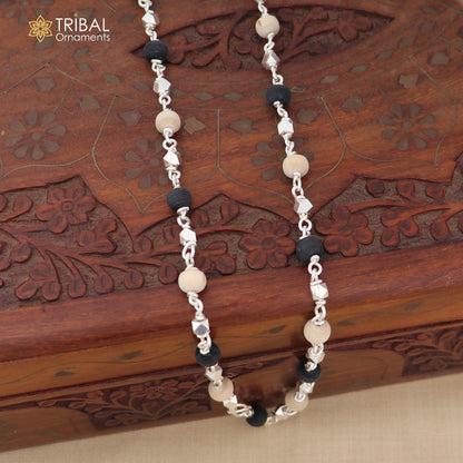 Handcrafted 925 silver Black Basil rosary beads with silver beads on a necklace chain, used as tulsi mala in Ayurveda practices.