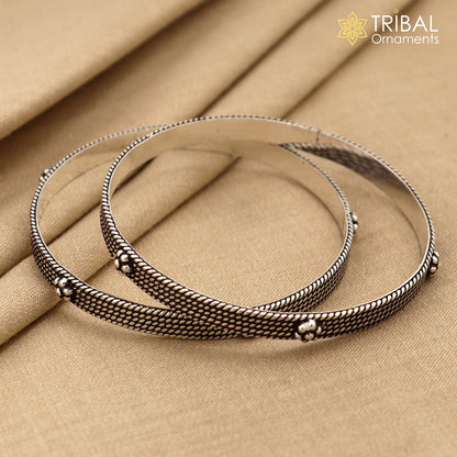 Sterling silver customized bangle bracelet with intricate design by TRIBAL ORNAMENTS, stylish jewelry for brides and special gifts.