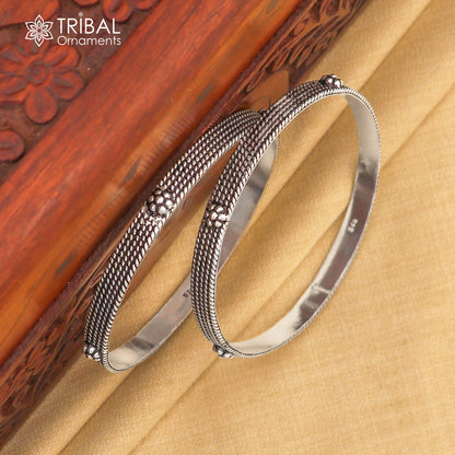 Sterling silver custom-designed bangle bracelet by Tribal Ornaments, featuring intricate patterns, perfect for gifting or brides.