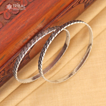 Sterling silver customized designer bangle bracelet by TRIBAL ORNAMENTS, featuring intricate work and stylish craftsmanship for gifting or brides.