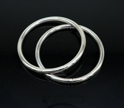 Sterling silver custom round bangle bracelet by Tribal Ornaments, stylish minimalist jewelry for brides and gifting.