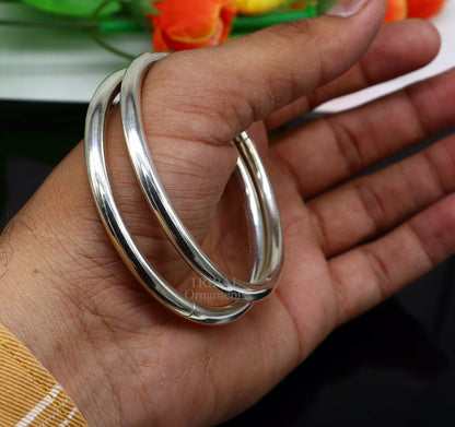 Sterling silver plain round bangle bracelet by TRIBAL ORNAMENTS, customizable designer jewelry for brides and special occasions.