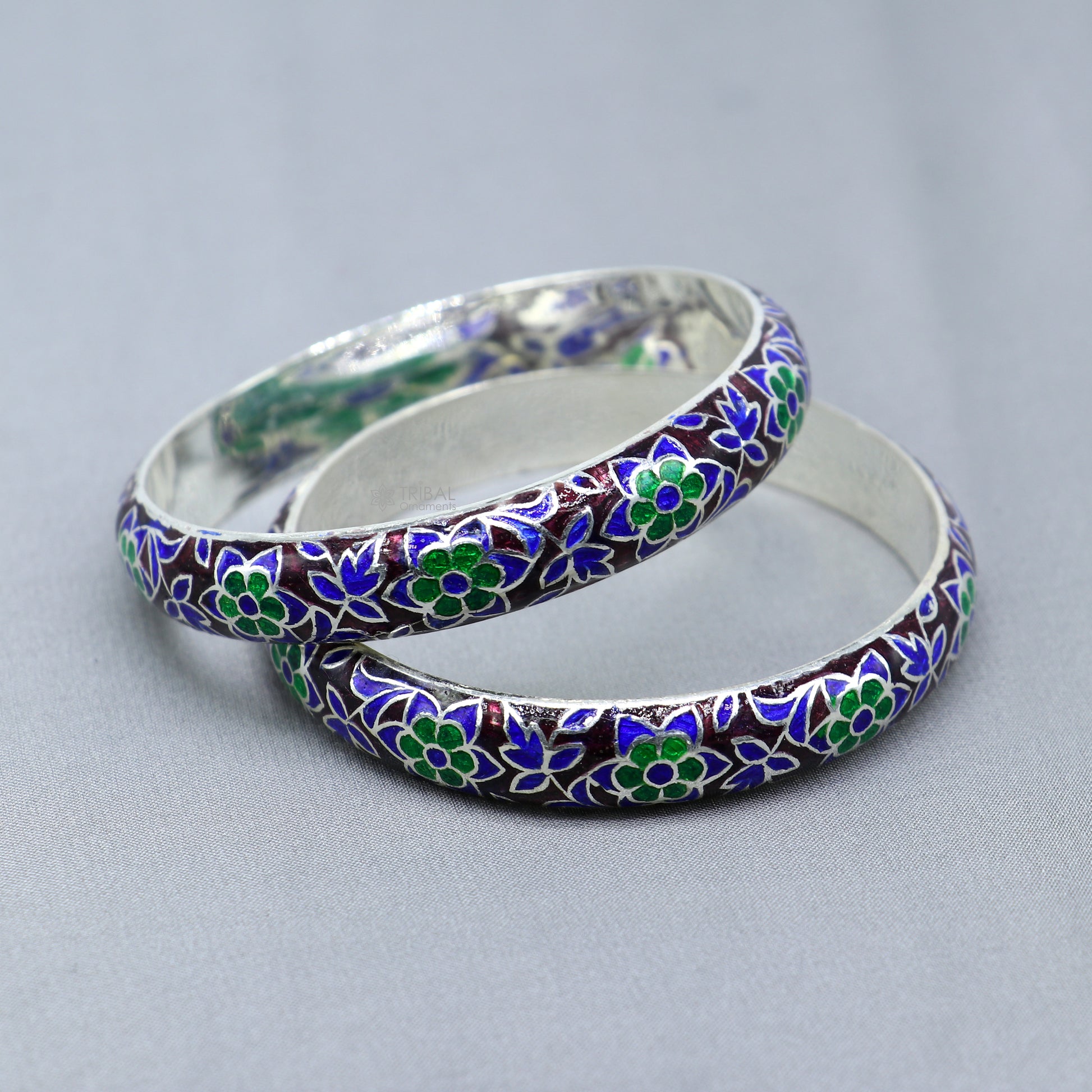 Sterling silver meenakari style designer bangle bracelet featuring intricate work, perfect for gifting or bridal jewelry.