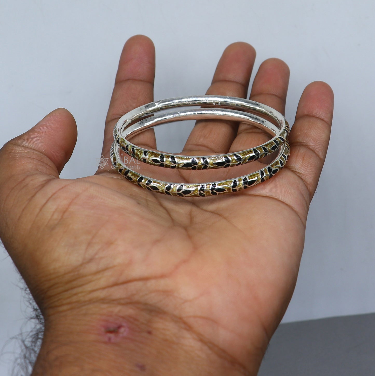 Sterling silver Meenakari work designer bangle bracelet from TRIBAL ORNAMENTS with intricate colorful patterns, ideal for bridal jewelry.