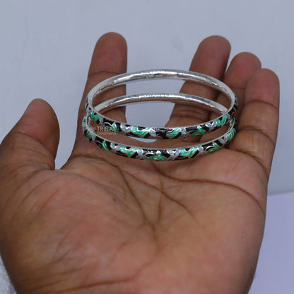 Sterling silver meenakari work bangle bracelet by TRIBAL ORNAMENTS, featuring intricate design, perfect for gifting or bridal jewelry.