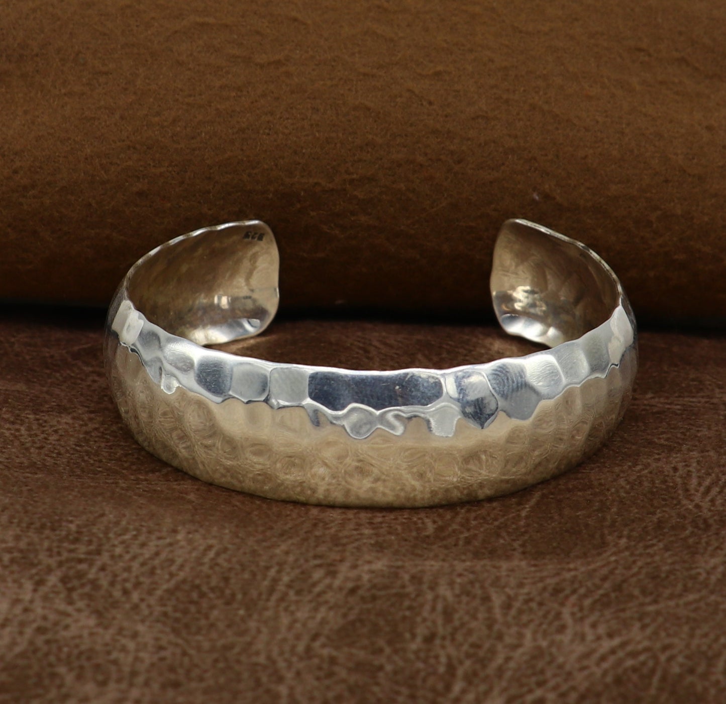 Sterling silver adjustable bangle bracelet with shiny spotted design, featuring a unique tribal style cuff from Tribal Ornaments.
