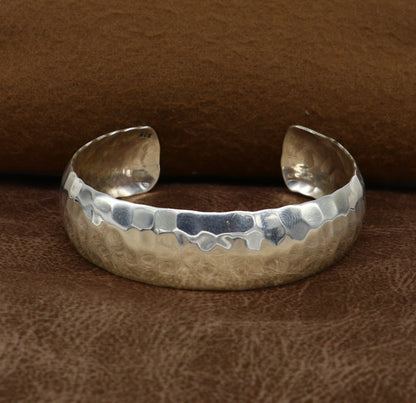 Sterling silver adjustable bangle bracelet with shiny spotted design, featuring a unique tribal style cuff from Tribal Ornaments.