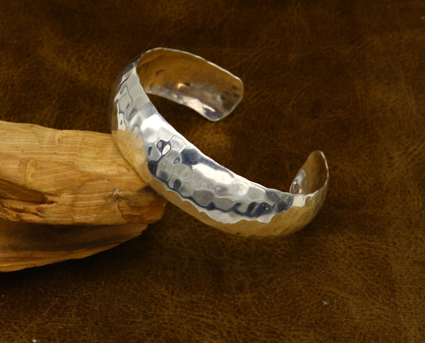 Sterling silver adjustable bangle bracelet with shiny bright spotted design from TRIBAL ORNAMENTS, featuring a unique cuff style.
