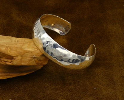 Sterling silver adjustable bangle bracelet with shiny bright spotted design from TRIBAL ORNAMENTS, featuring a unique cuff style.