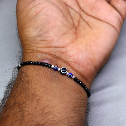 Sterling silver evil eye beaded chain bracelet with black beads, designed for moms or babies, by TRIBAL ORNAMENTS.