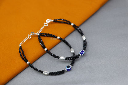 Sterling silver and blue evil eye beaded bracelet combo, suitable for mothers or babies, with intricate beaded and silver details.