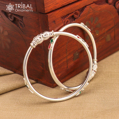 Sterling silver baby bangle bracelet with ball design by TRIBAL ORNAMENTS, showcasing sleek silver jewelry for infants.