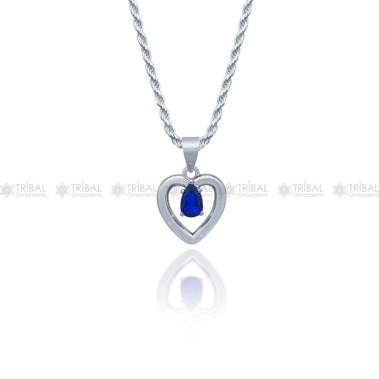 925 Sterling silver pendant set with blue sapphire heart-shaped gemstone, featuring intricate tribal design by Tribal Ornaments