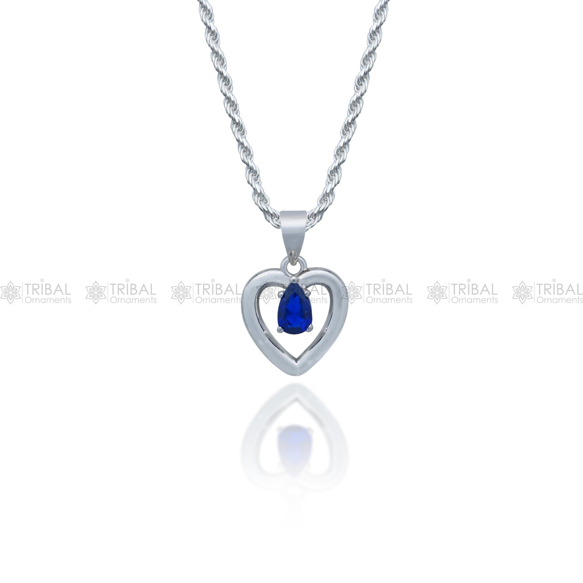 925 Sterling silver pendant set with blue sapphire heart-shaped gemstone, featuring intricate tribal design by Tribal Ornaments