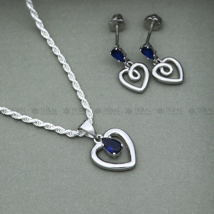 Sterling silver blue sapphire heart-shaped pendant set with sparkling diamonds, elegant jewelry by TRIBAL ORNAMENTS.