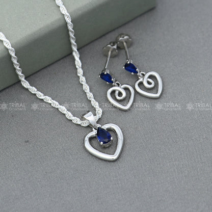 Sterling silver blue sapphire heart-shaped pendant set with matching earrings, crafted by TRIBAL ORNAMENTS.