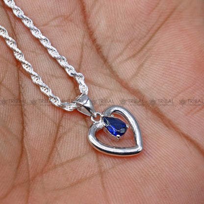 925 Sterling silver blue sapphire heart-shaped pendant set by Tribal Ornaments, featuring sparkling blue diamond accents.