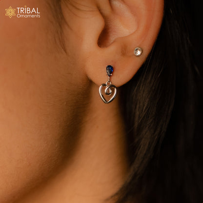 925 Sterling silver pendant set with blue sapphire heart-shaped charm, featuring sparkling blue diamonds and intricate tribal design.