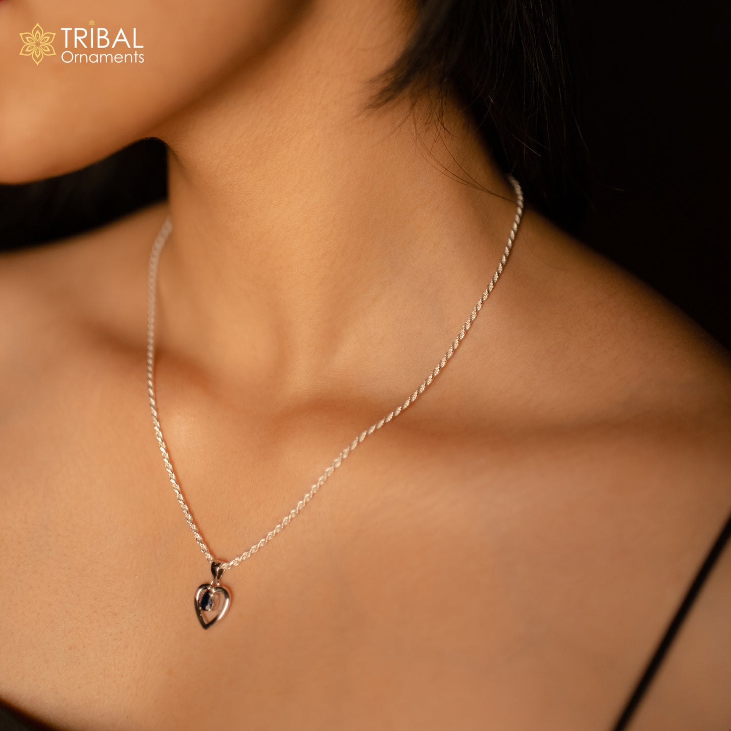 925 Sterling silver pendant set with blue sapphire heart-shaped gemstone, featuring a delicate and elegant jewelry design.