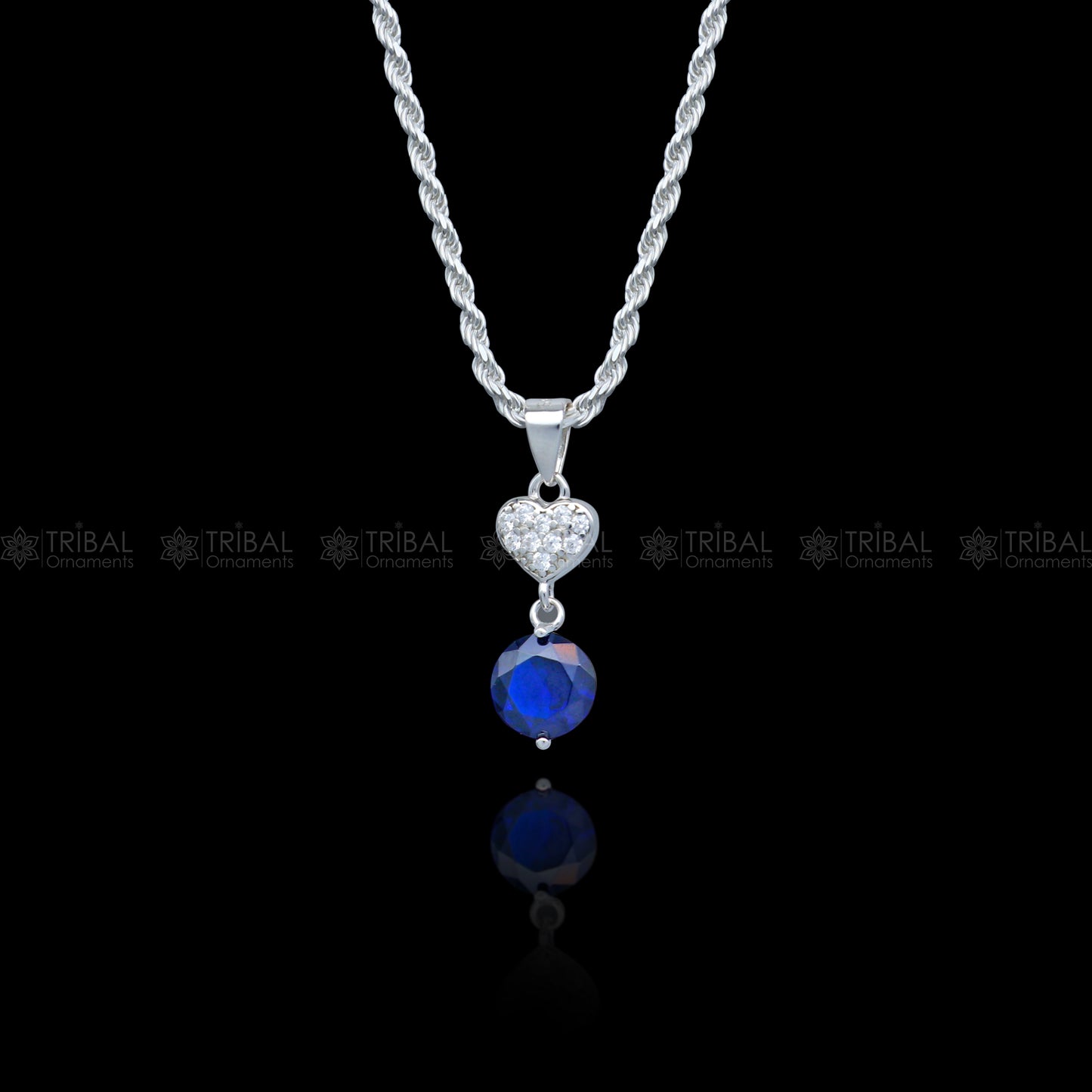 925 Sterling silver pendant set with round blue sapphire diamond, featuring a sleek, elegant design by Tribal Ornaments.