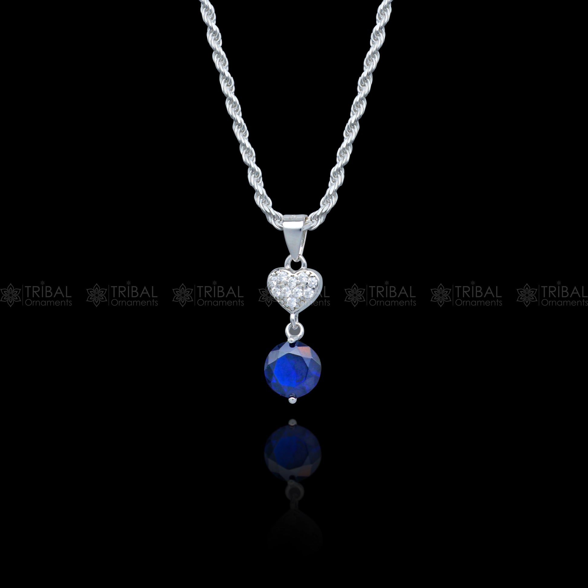 925 Sterling silver pendant set with round blue sapphire diamond, featuring a sleek, elegant design by Tribal Ornaments.
