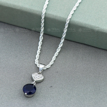 925 Sterling silver pendant set with round blue sapphire diamond, featuring a polished, elegant design by Tribal Ornaments.