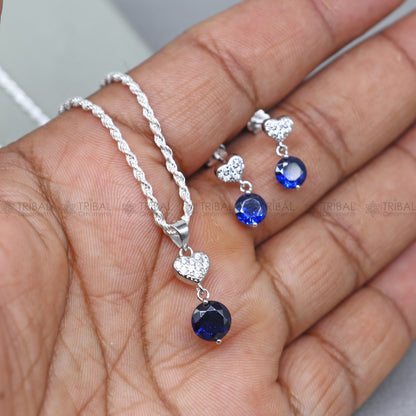 Sterling silver pendant set with round blue sapphire diamond from Tribal Ornaments, showcasing a elegant jewelry design.