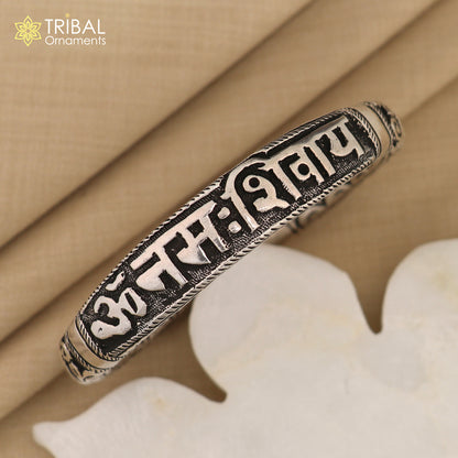 Sterling silver Chitai work bracelet with "Om Namah Shivay" mantra, tribal ornament jewelry, traditional kada design.