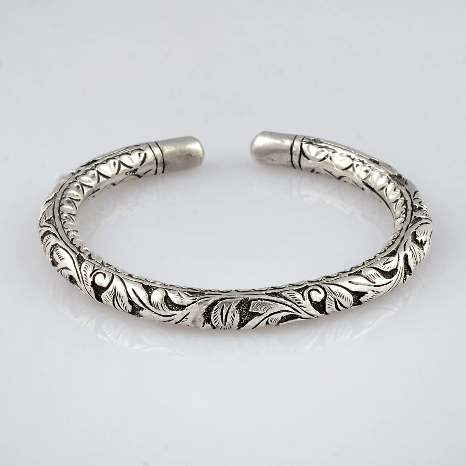 Sterling silver chitai work tribal wrist bangle cuff, ethnic tribal jewelry by TRIBAL ORNAMENTS showcasing intricate designs.