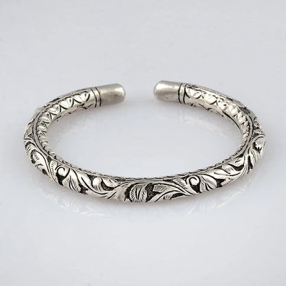 Sterling silver chitai work tribal wrist bangle cuff, ethnic tribal jewelry by TRIBAL ORNAMENTS showcasing intricate designs.