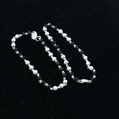 Sterling silver Krishna necklace or baby Nazariya bracelet with black beads, designed to protect from evil eyes for babies.