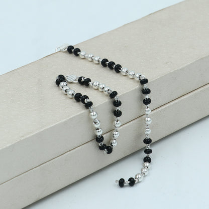 Sterling silver Krishna necklace or baby Nazariya bracelet with black beads, designed to protect from evil eyes for infants.