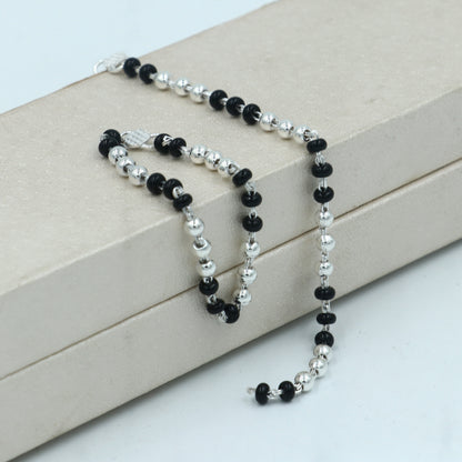 Sterling silver Krishna necklace or baby Nazariya bracelet with black beads, designed to protect from evil eyes for babies.