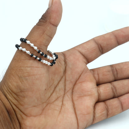 Sterling silver Krishna necklace or baby Nazariya bracelet with black beads, designed to protect from evil eyes for infants.