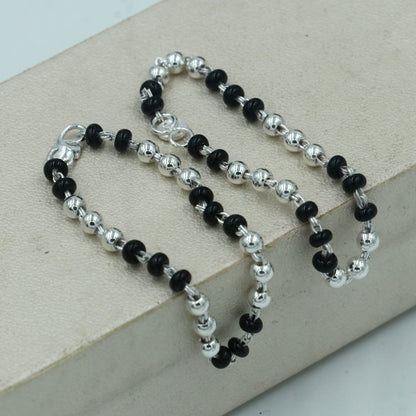 Sterling silver Krishna necklace or baby Nazariya bracelet with black beads, designed to protect from evil eyes for infants.