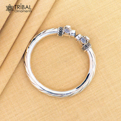 Sterling silver flexible bangle bracelet with blue turquoise stone, featuring custom design and stylish craftsmanship from Tribal Ornaments.